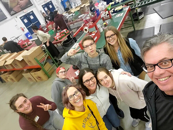 Students and teachers at the Samaratin's Purse Shoebox warehouse